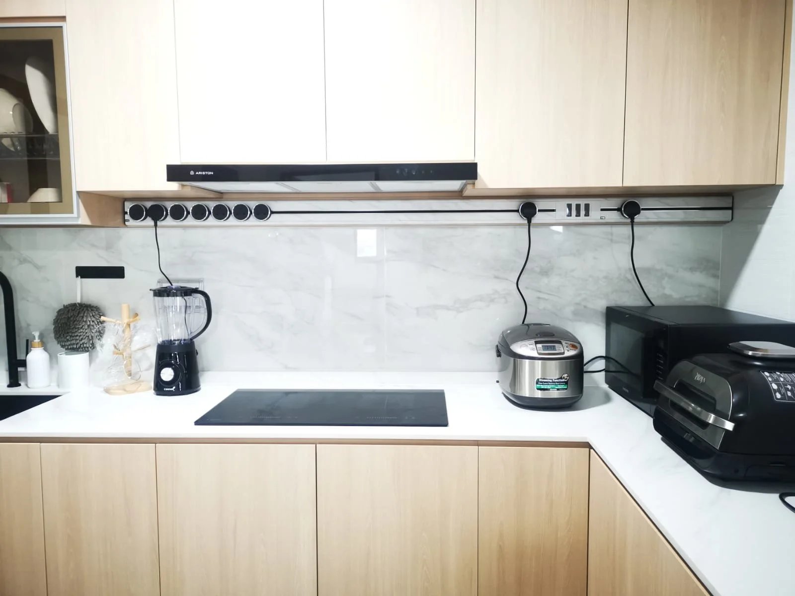 Line8 Model SL track in Silver Hairline above the kitchen countertop powering appliances