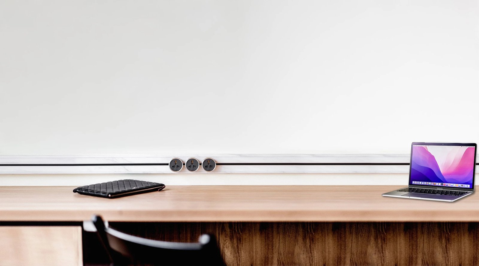 Line8 Model SL track in Silver Hairline above a wooden desk with a laptop and a notepad